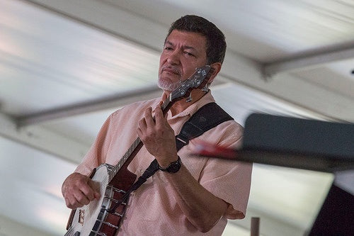 Don Vappie playing banjo at New Orleans JazzFest