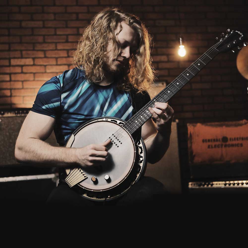 Jacob Moore with his Deering Phoenix 6-string banjo